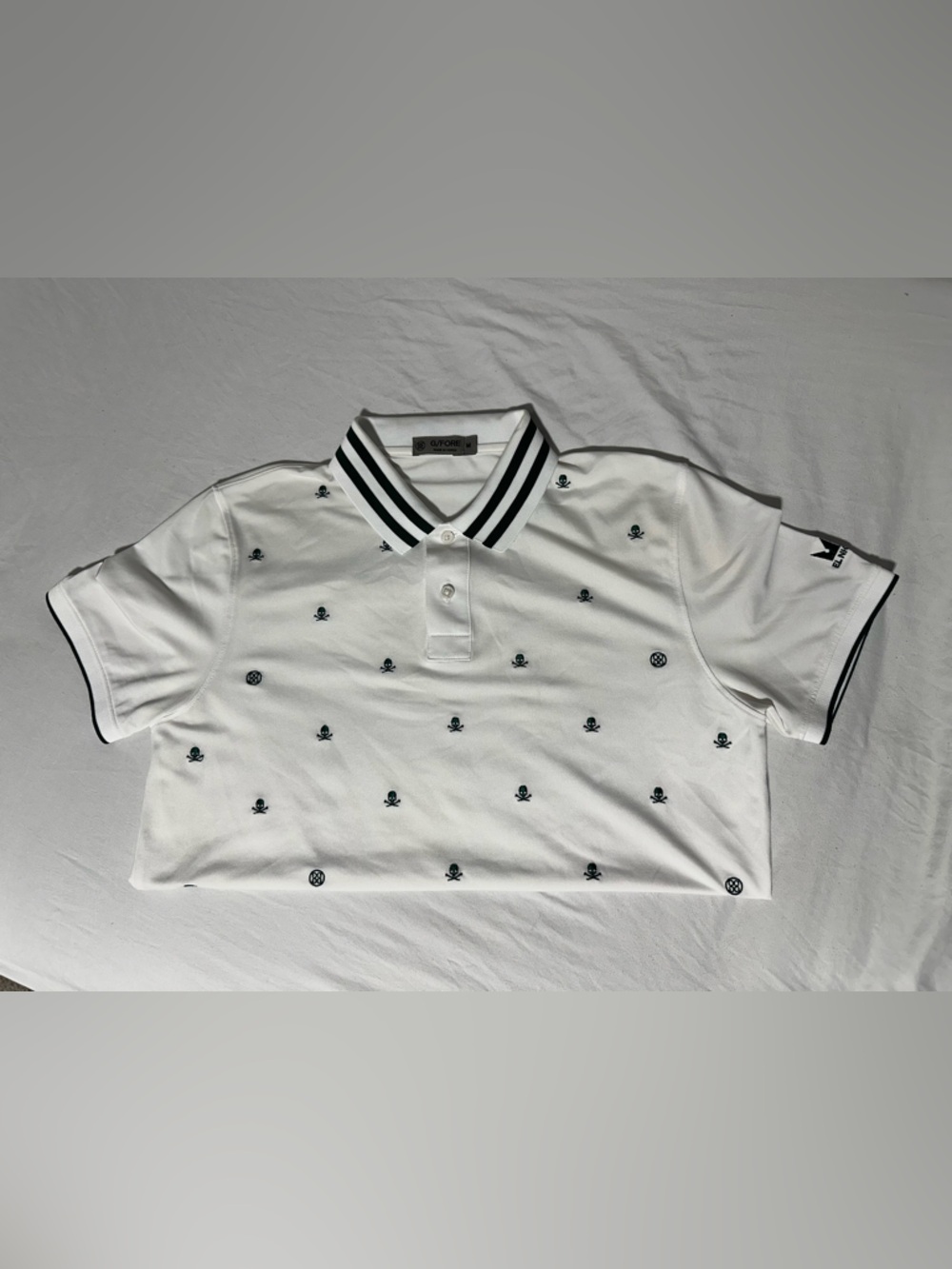 G/FORE-Golf Skulls & Tees Green & White Polo Shirt CC logo on left sleeve.